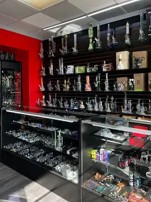 Inside view of Mr. Puff smoke shop in Cypress, TX showcasing glass bongs and vape products on shelves